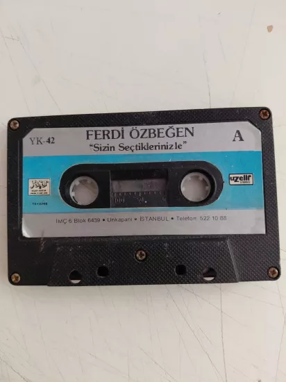 Ferdi Özbeğen – Sizin Seçtiklerinizle  -  Türkiye Basım  Kaset - Uzelli Kağıt Baskı
